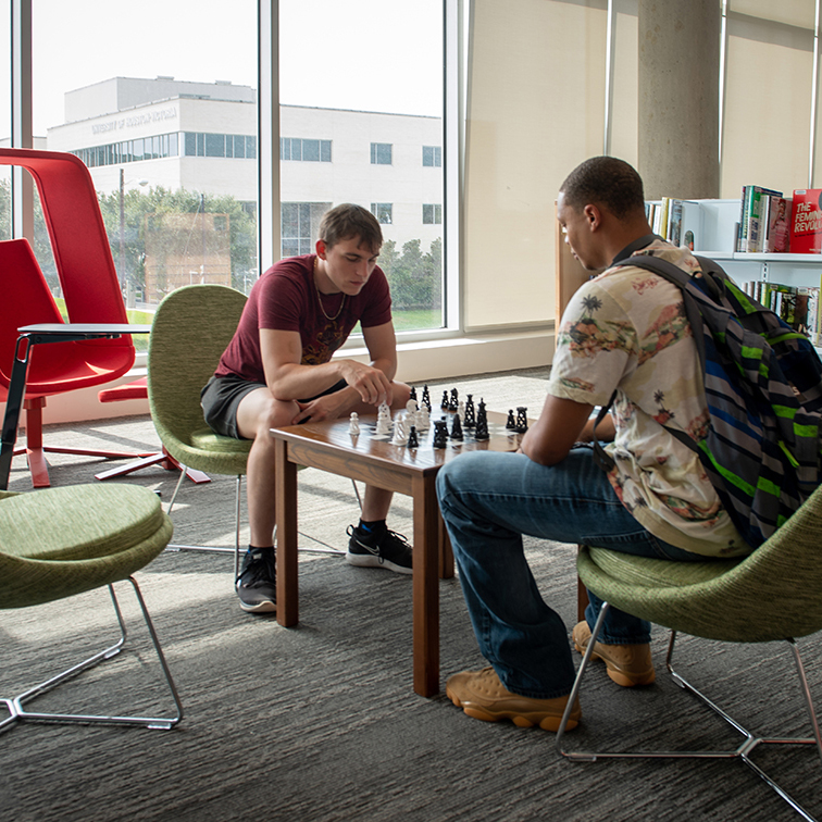 UHV students playing chess at University Commons