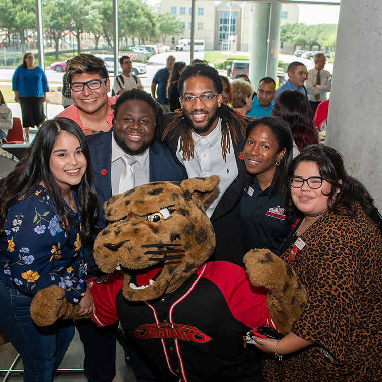 students posing with jaX