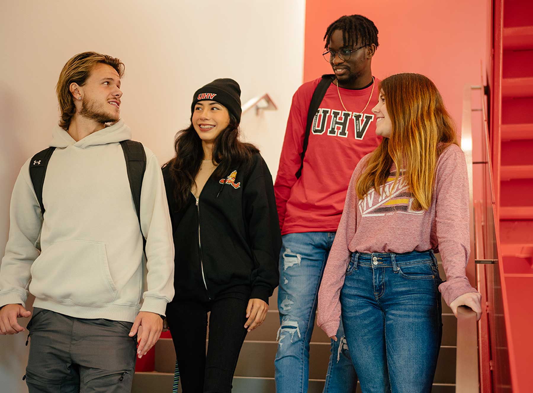 Four students wearing UHV clothing 